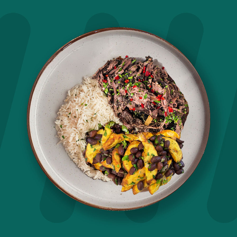 Smoked Jerk Pulled Beef, Coconut Rice, Roasted Plantain And Black Beans