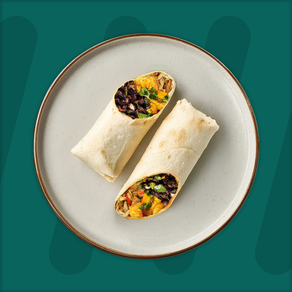  A colorful plate featuring shredded Mexican-spiced chicken garnished with fresh herbs, served alongside a portion of vibrant green cilantro rice. Complementing the dish is a side of roasted corn mixed with crumbled feta cheese, adding a touch of creaminess and texture. The meal is presented on a minimalist ceramic plate with a dark rim, set against a rich green background for a fresh and appetizing presentation. prepped meal.